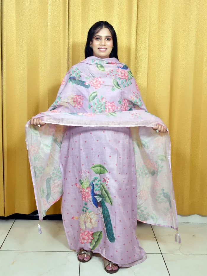 Woman in Graceful Lavender Salwar Suit with Peacock Motif and Floral Dupatta